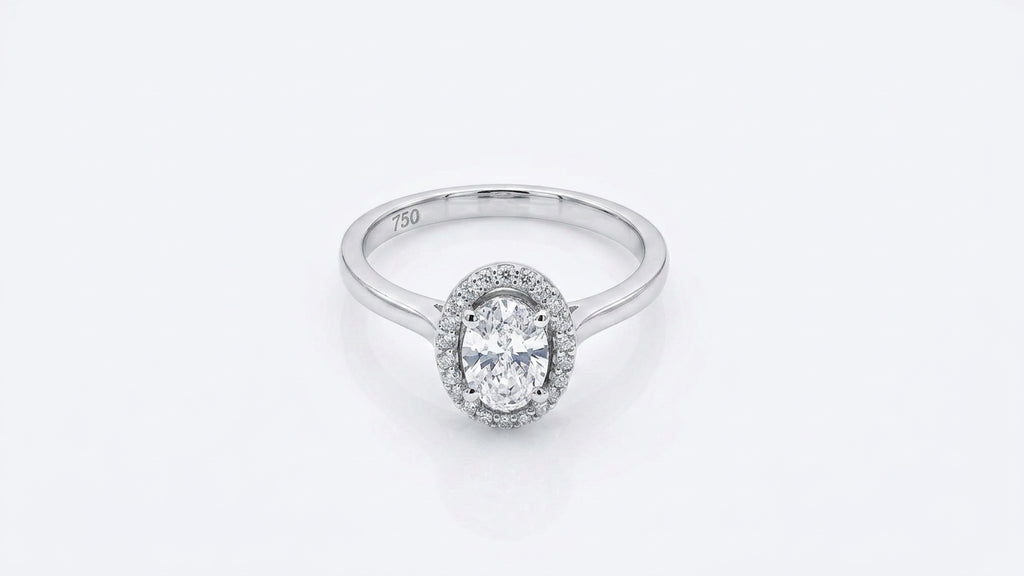 0.56 Carat Oval cut Lab Diamond in 18K WG ring