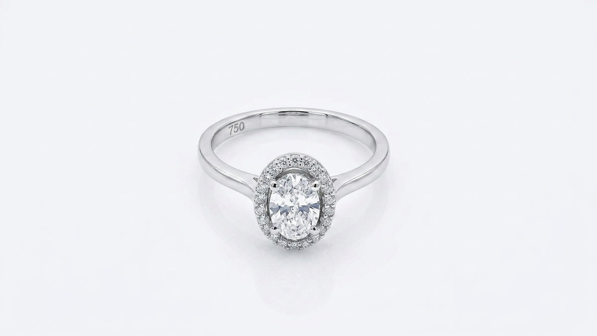 0.56 Carat Oval cut Lab Diamond in 18K WG ring