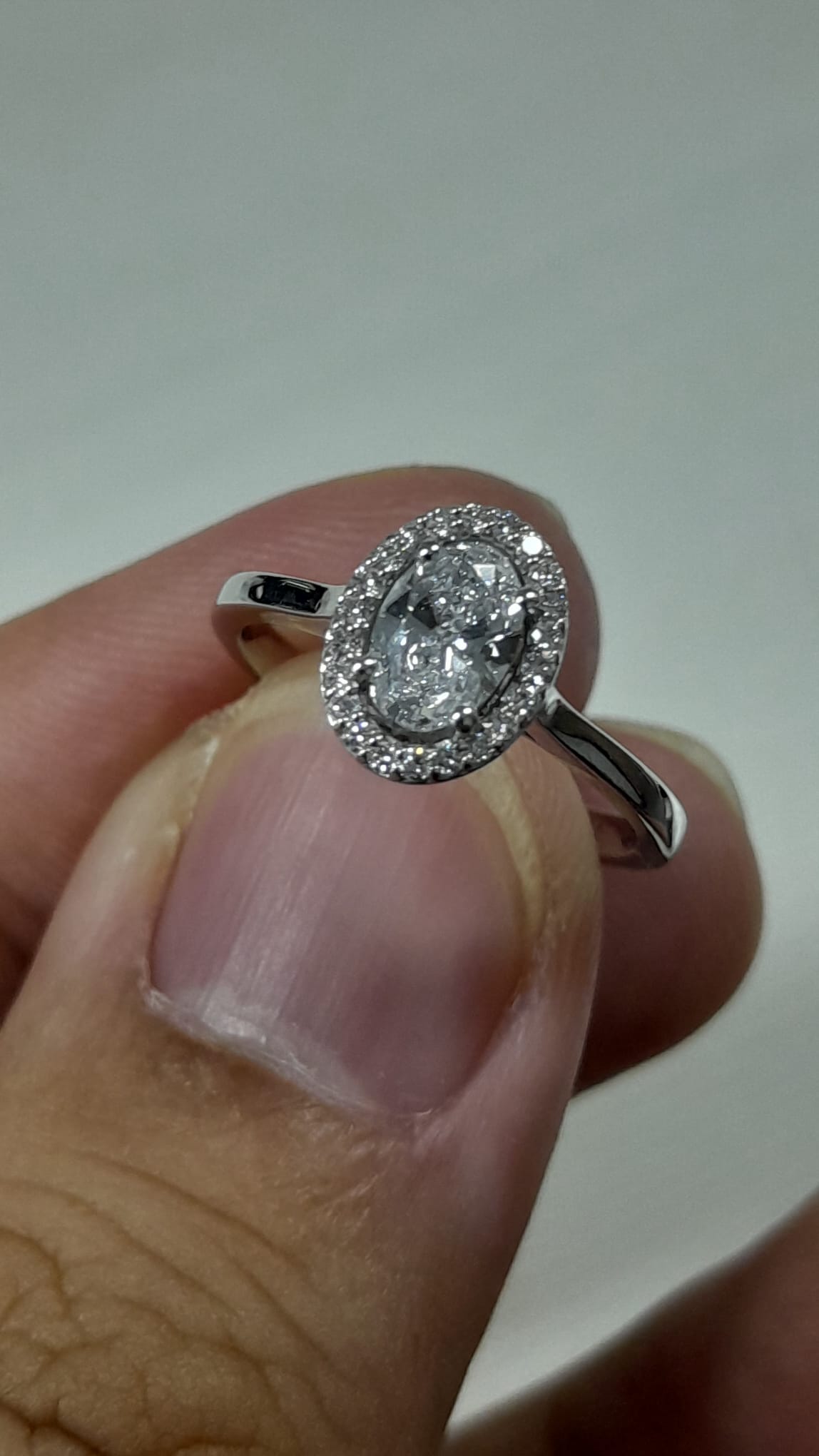 0.56 Carat Oval cut Lab Diamond in 18K WG ring