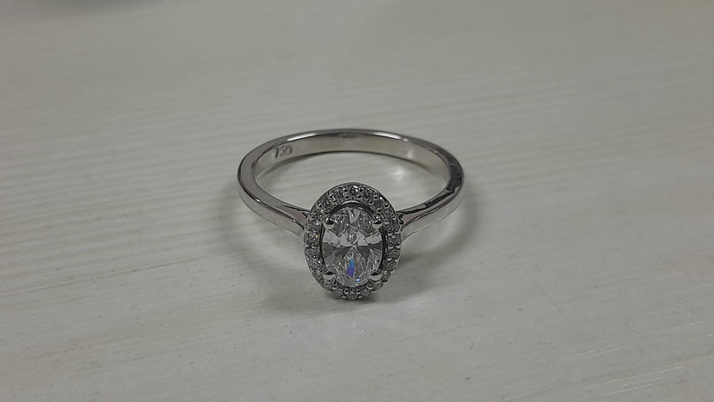 0.56 Carat Oval cut Lab Diamond in 18K WG ring