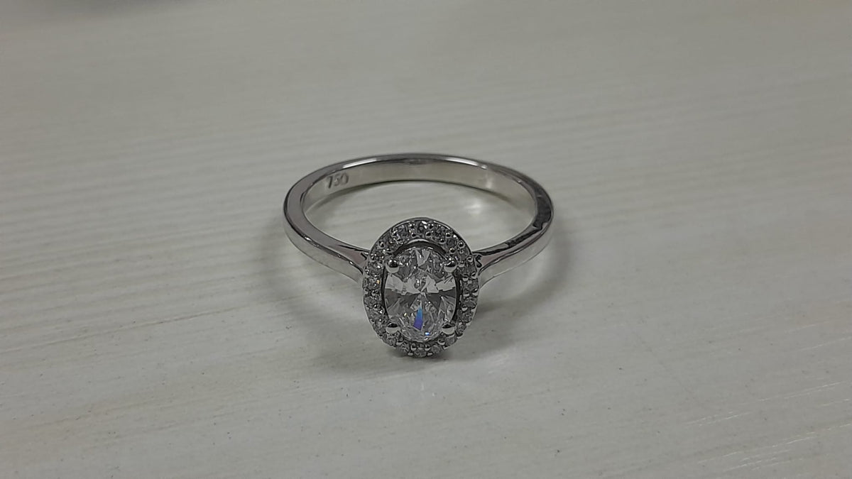 0.56 Carat Oval cut Lab Diamond in 18K WG ring