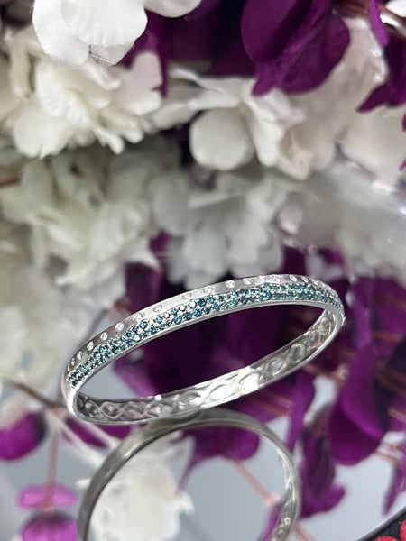 0.47 Carat White diamonds and 1.45 Carat Blue Diamonds in 14K WG Bangle