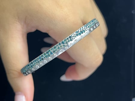 0.47 Carat White diamonds and 1.45 Carat Blue Diamonds in 14K WG Bangle