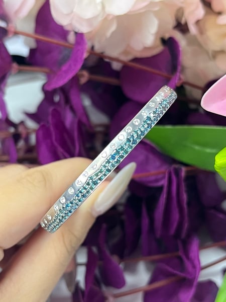 0.47 Carat White diamonds and 1.45 Carat Blue Diamonds in 14K WG Bangle