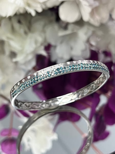 0.47 Carat White diamonds and 1.45 Carat Blue Diamonds in 14K WG Bangle