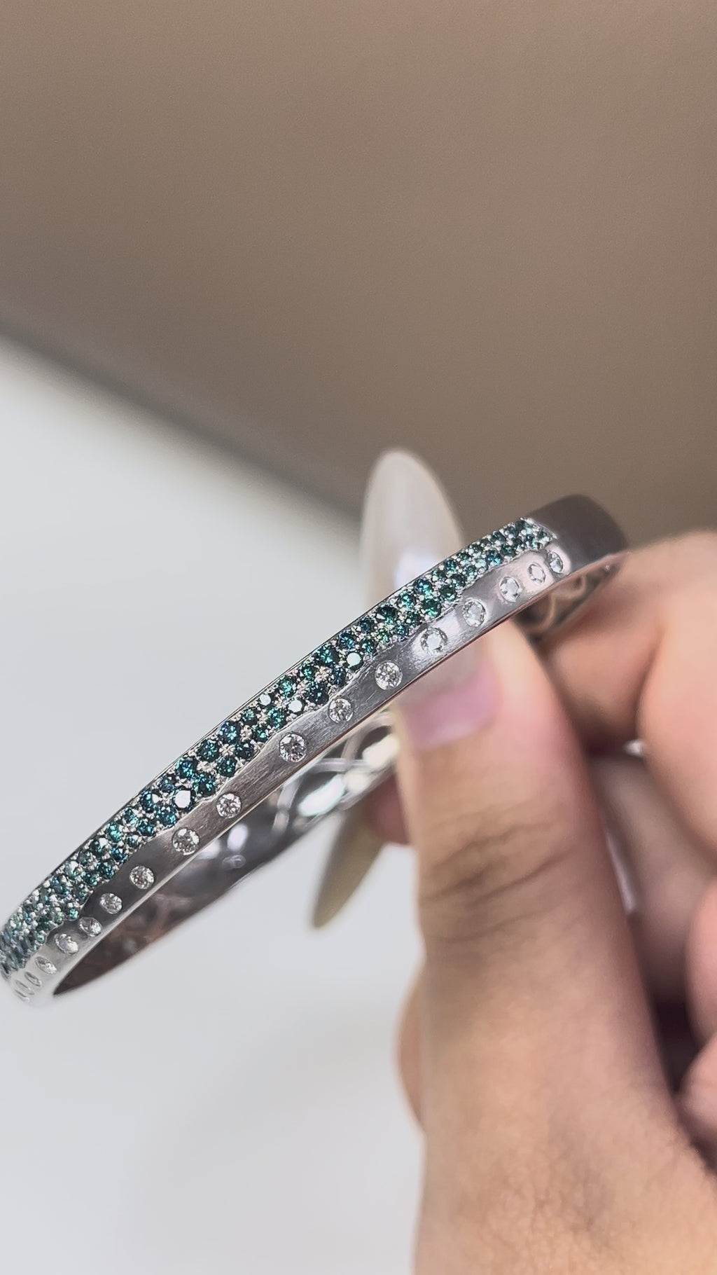 0.47 Carat White diamonds and 1.45 Carat Blue Diamonds in 14K WG Bangle